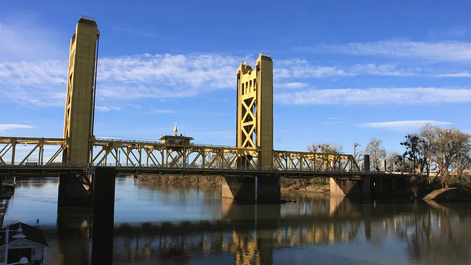 The gold Tower Bridge over the Sacramento River in Sacramento on a sunny day